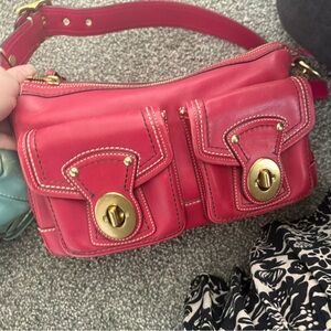 Coach 65th Anniversary Turnlock color raspberry